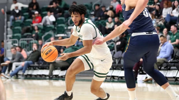 Portland State’s Isaiah Johnson drives against NAU.